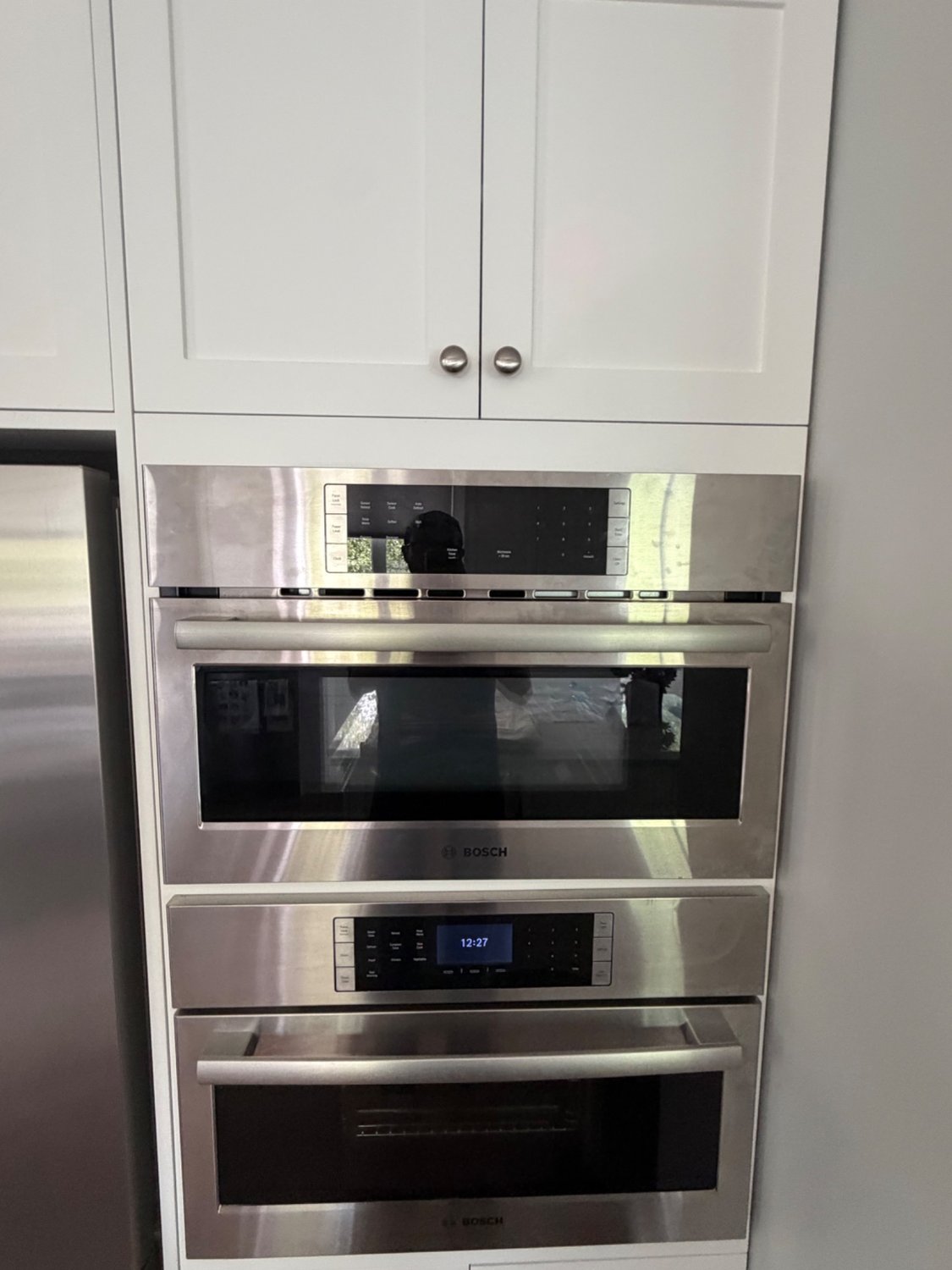 Bosch built-in microwave and wall oven stack in a west Calgary kitchen before TechVill service