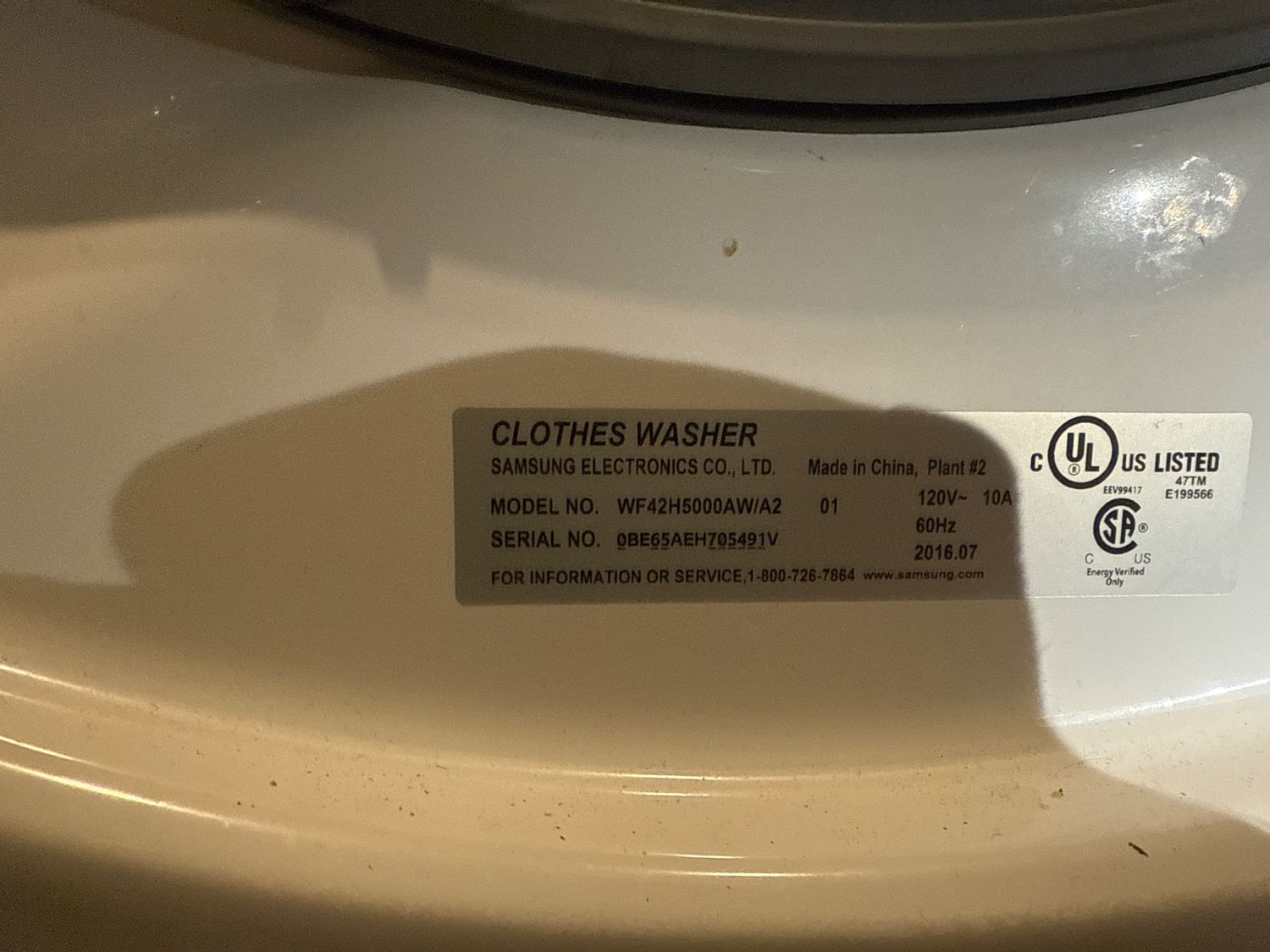 Samsung WF42H5000AW clothes washer model plate photographed during service in downtown Calgary