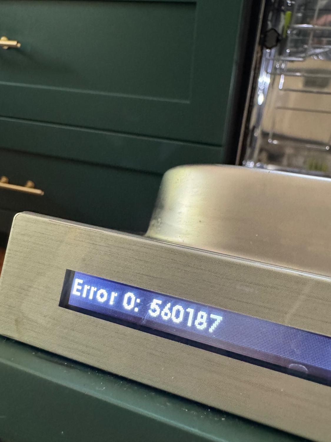 Cove DW2450WS dishwasher display showing stored error 560187 in a Canmore, Alberta kitchen
