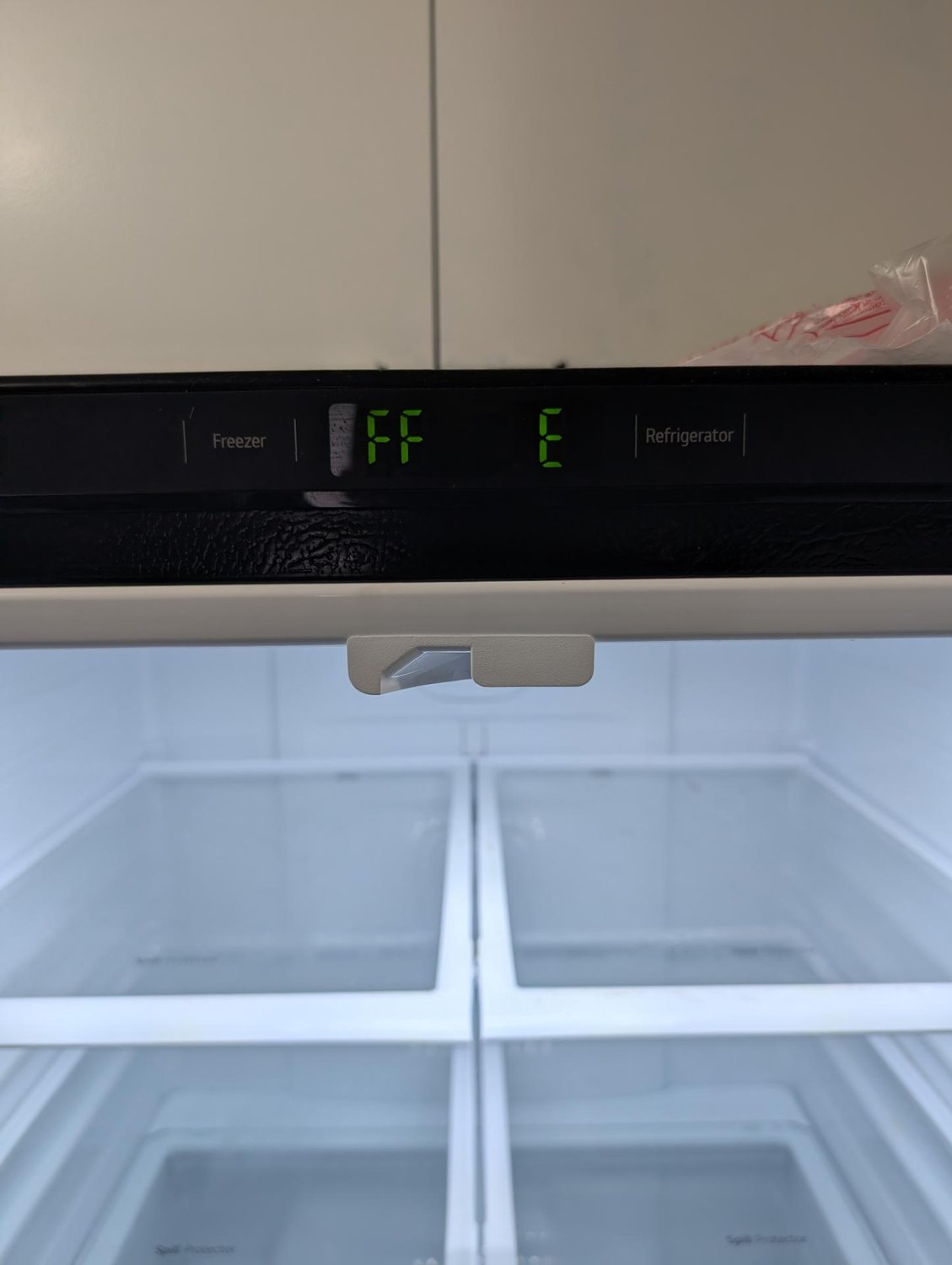 LG refrigerator display showing the FF E error code for an evaporator fan fault in Windermere, Edmonton