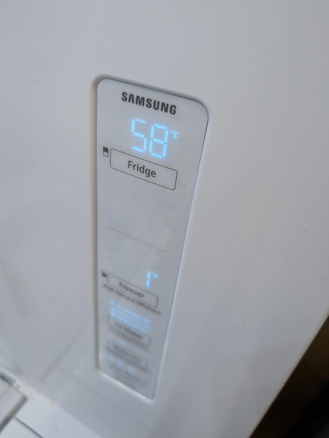 Samsung refrigerator control panel showing the fridge compartment at 58 degrees Fahrenheit during diagnosis in Edmonton
