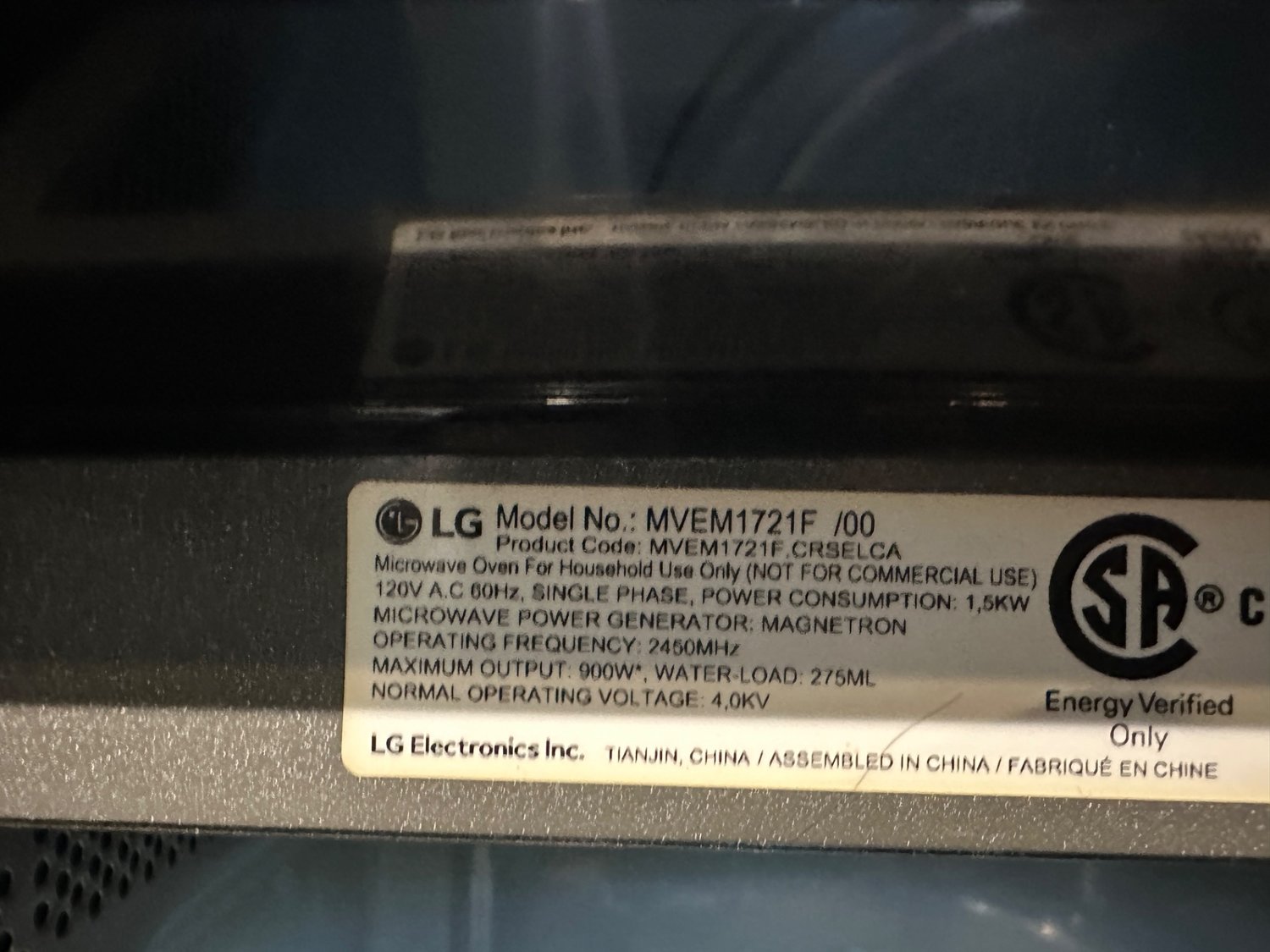 LG MVEM1721F over-the-range microwave model plate photographed during TechVill diagnosis in Surrey, BC