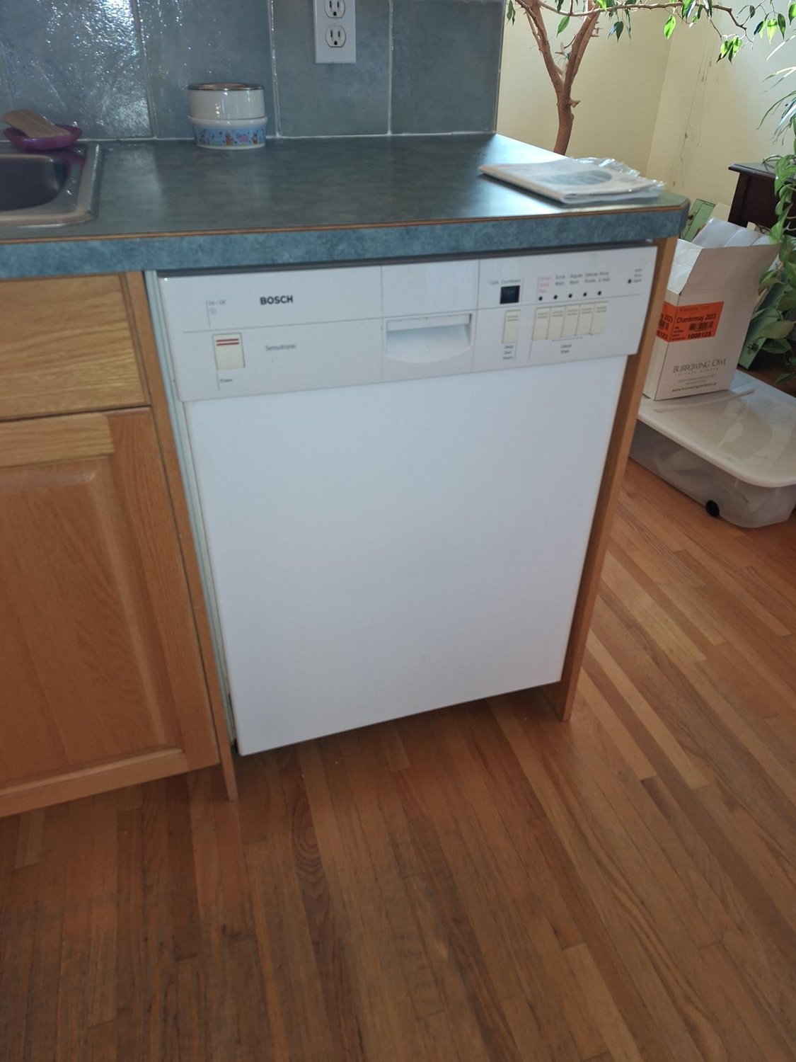 Bosch built-in dishwasher installed in an oak kitchen cabinet run in southwest Calgary before diagnosis
