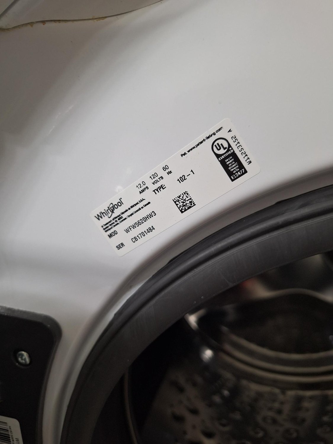 Whirlpool WFW5620HW3 washing machine rating plate confirming the model and serial number during service in Calgary