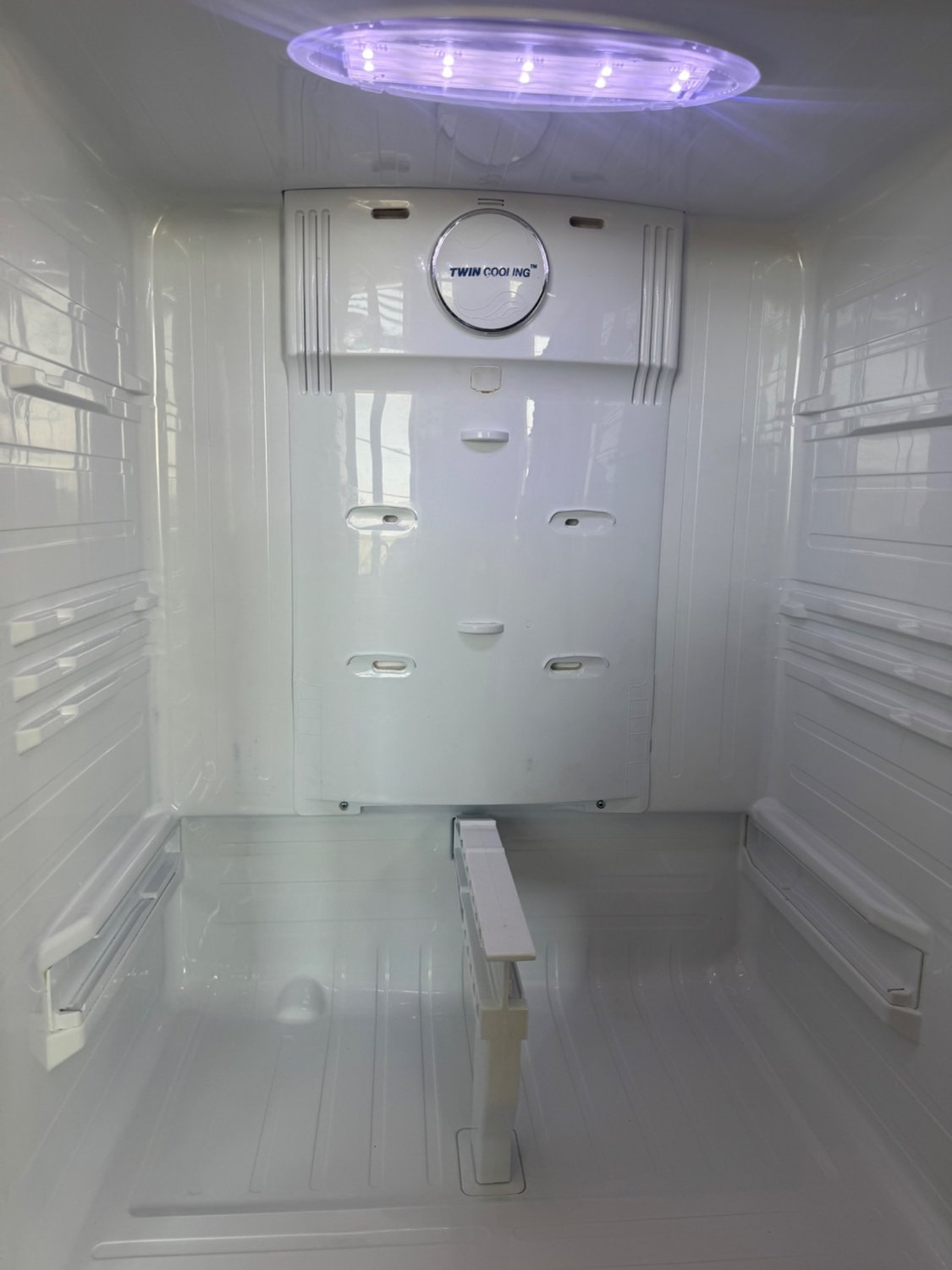 Clean, dry fresh food compartment of a Samsung Twin Cooling refrigerator in Cochrane after the drain tube was cleared