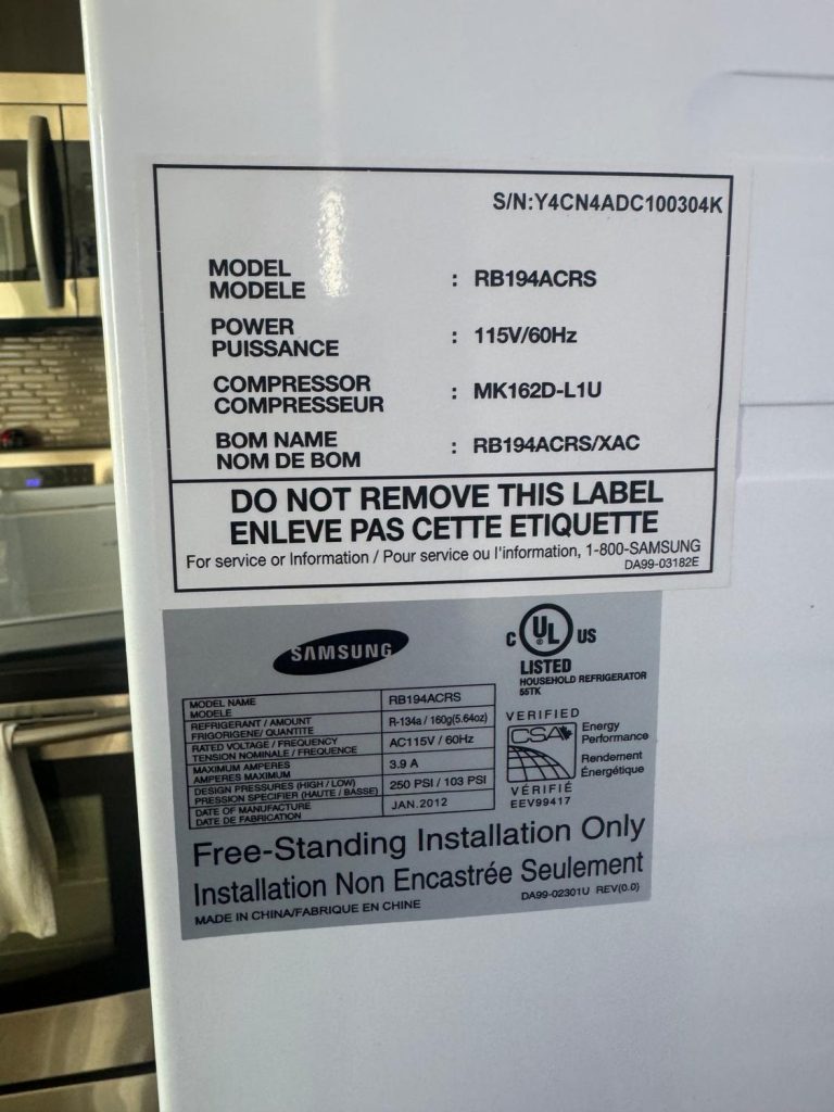 Samsung RB194ACRS rating plate showing a January 2012 build date during refrigerator service in Cochrane, Alberta