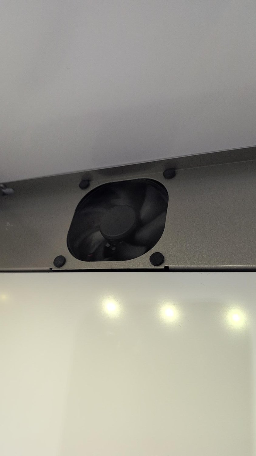 Evaporator fan in its housing at the top of the fresh food section of a Bertazzoni built-in refrigerator