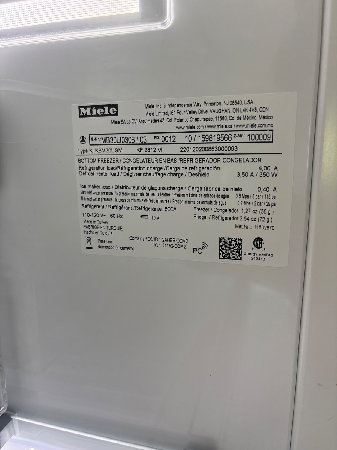 Miele KF 2812 Vi rating plate identifying a built-in bottom-freezer refrigerator during a rural Alberta service call