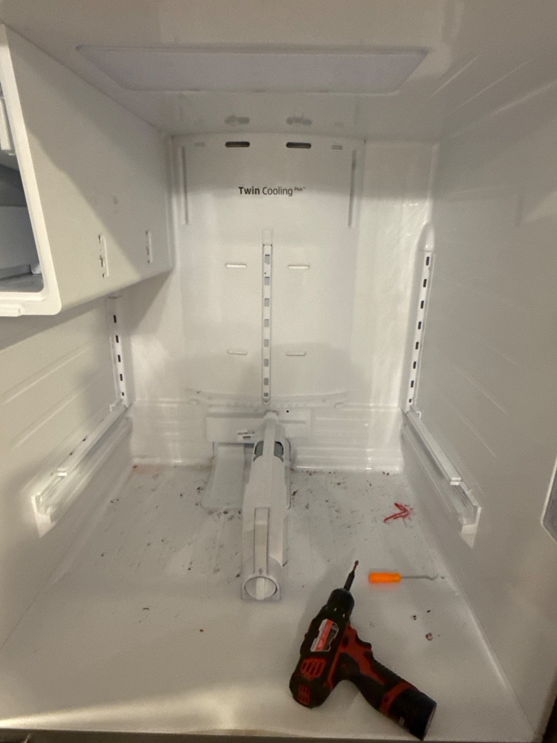 Fresh food compartment of a Samsung Twin Cooling Plus refrigerator opened up for defrost component replacement in Surrey