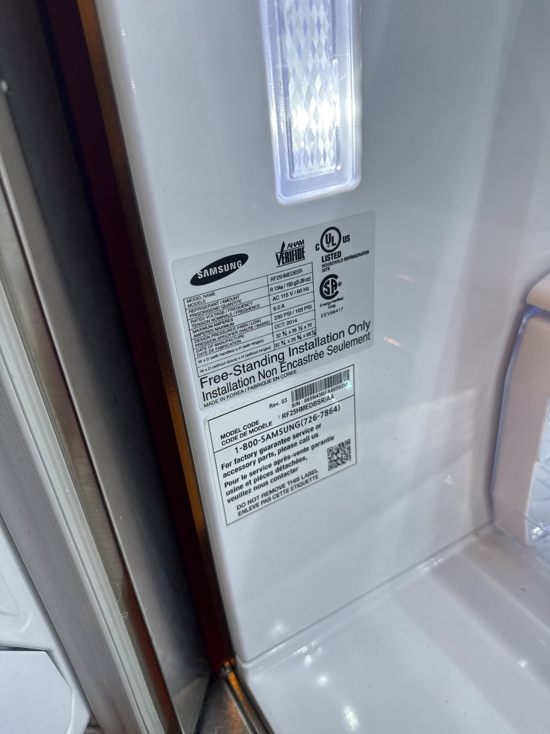 Samsung RF25HMEDBSR rating plate showing an October 2014 build date during refrigerator service in Surrey, BC